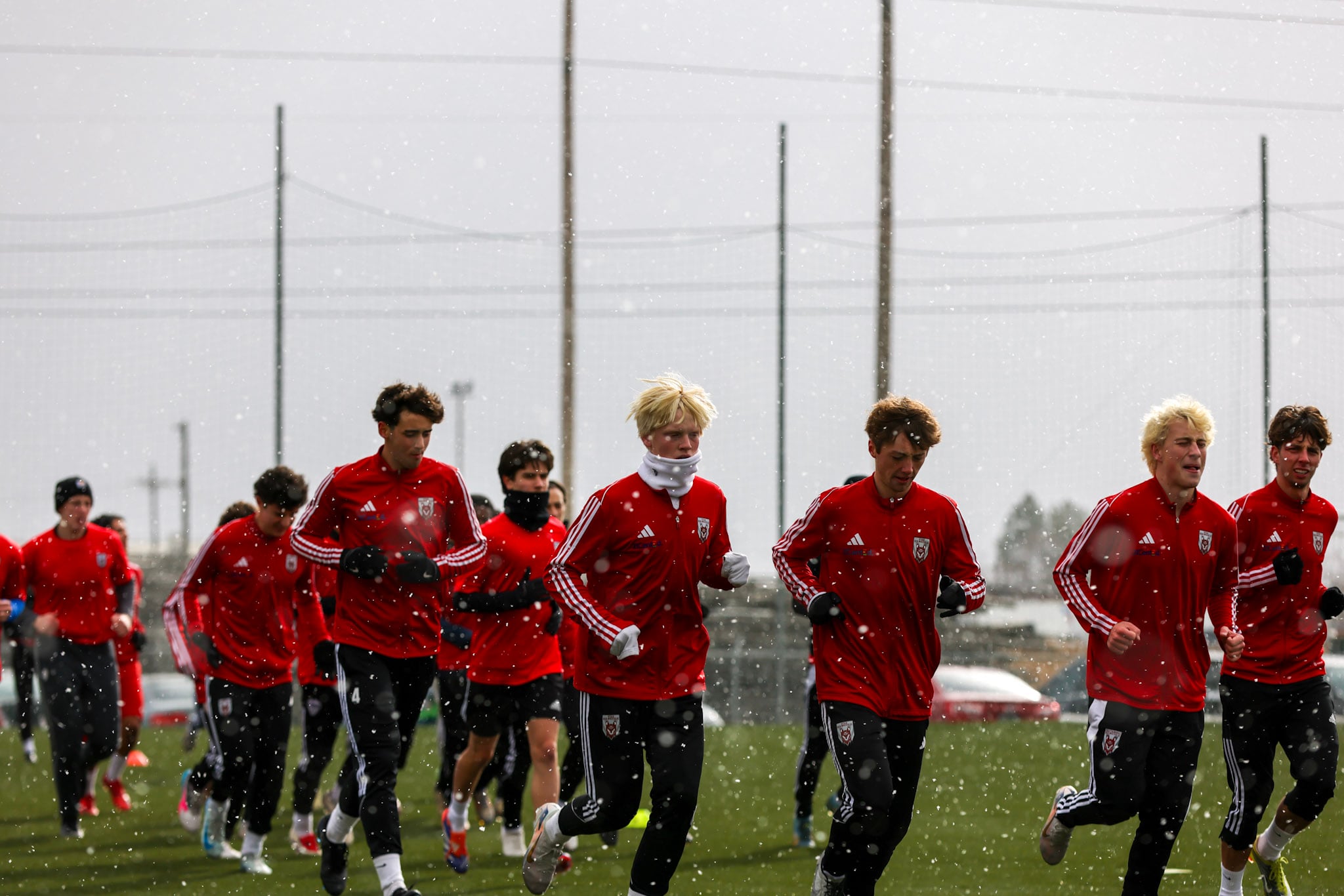 Utah Red Wolves Academy players training in snowy conditions, showcasing dedication and resilience